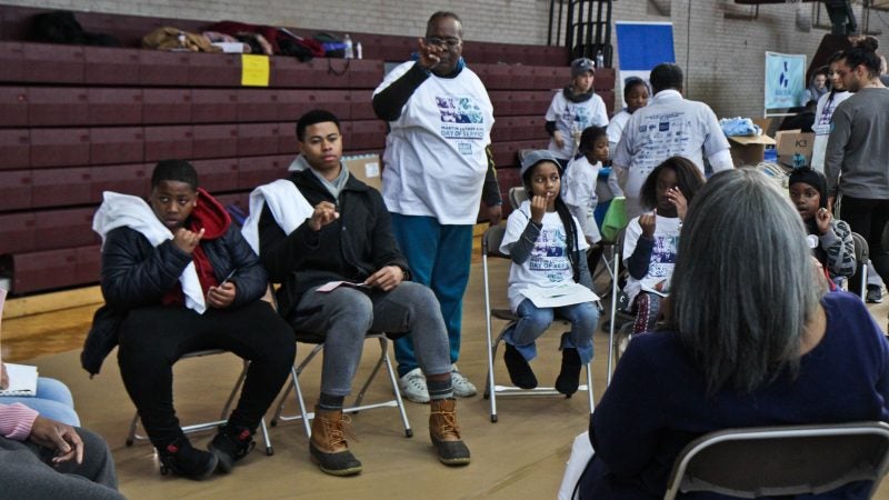 The Germantown Deaf Ministries gives a lesson on the sign language alphabet. (Kimberly Paynter/WHYY)