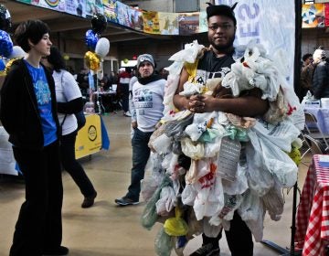 Timell Sherard dress as the plastic bad monster to convince people to cut back on plastic bag use. (Kimberly Paynter/WHYY)