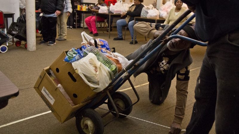 Volunteers in Reading hand out food and help the older and disabled. (Kimberly Paynter/WHYY)