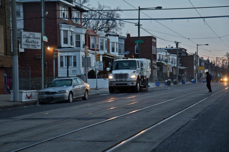 A city street sweeper cleans Chester Avenue in Southwest Philadelphia. (Kimberly Paynter)