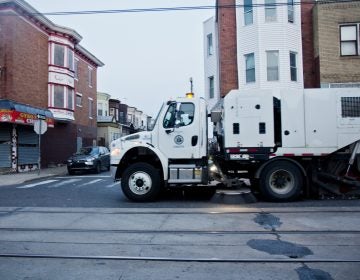 A city street sweeper cleans Chester Avenue in Southwest Philadelphia. (Kimberly Paynter)