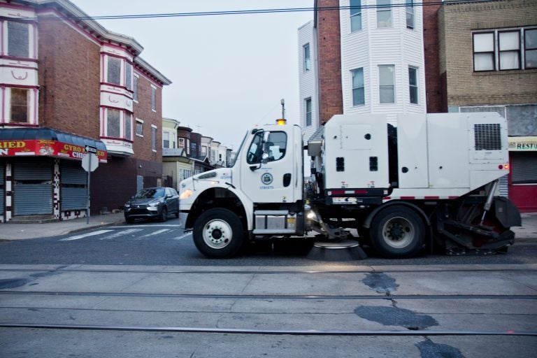 A city street sweeper cleans Chester Avenue in Southwest Philadelphia. (Kimberly Paynter)