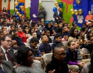 John F. Hartranft Elementary students listen to speakers at a ceremony honoring the announcement of this year's school progress reports. (Brad Larrison for WHYY)