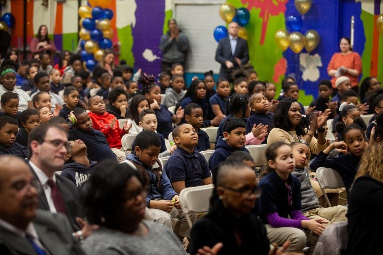 John F. Hartranft Elementary students listen to speakers at a ceremony honoring the announcement of this year's school progress reports. (Brad Larrison for WHYY)