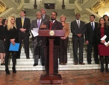 A bipartisan group of lawmakers and others announces a new bill aimed at reforming Pennsylvania's probation and parole systems. (Katie Meyer/WITF)