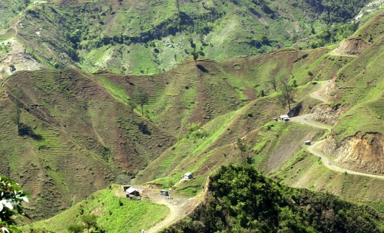 The denuded slopes of Massif de la Selle mountain range in Haiti above Jacmel, are seen Thursday June 5, 2003. Once covered with pine, cedar and juniper trees, the slopes are on their way to complete deforestation as farmers cut down trees and plant vegetables in the fragile topsoil. (Daniel Morel/AP Photo)