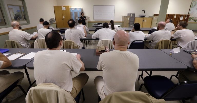 In this photo taken Thursday, Jan. 28, 2016, inmates look on in their college world history class at the Monroe Correctional Complex in Monroe, Wash. College education in American prisons is starting to grow again, more than two decades since federal government dollars were prohibited from being used for college programs behind bars. (Elaine Thompson/AP Photo)