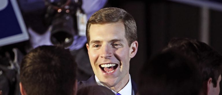 Conor Lamb, the Democratic candidate for the March 13 special election in Pennsylvania's 18th Congressional District, center, celebrates with his supporters at his election night party in Canonsburg, Pa., early Wednesday, March 14, 2018. (Gene J. Puskar/AP Photo)