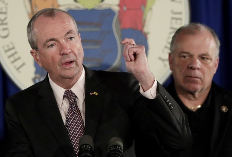 In this June 30, 2018, file photo, New Jersey Gov. Phil Murphy, (left), discusses his state budget deal with Democratic legislative leaders, as state Senate President Stephen Sweeney, (right), listens during a news conference in Trenton, N.J. (Julio Cortez/AP Photo, File)