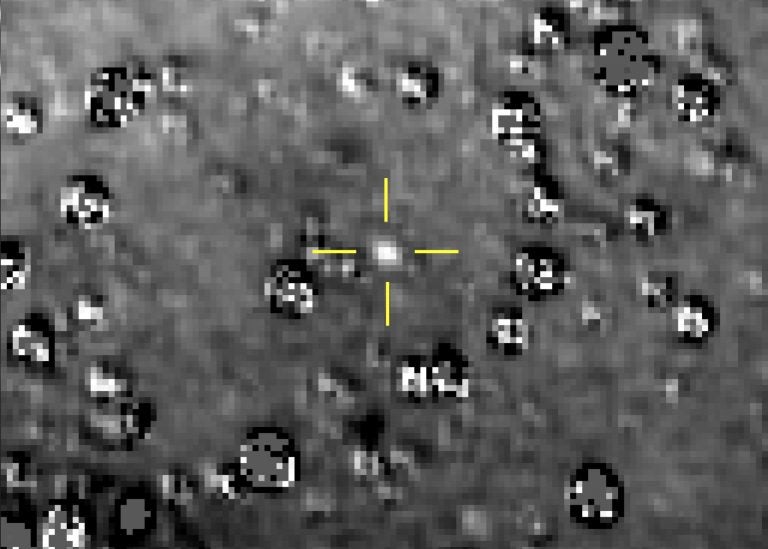 This composite image made available by NASA shows the Kuiper Belt object nicknamed Ultima Thule indicated by the crosshairs at center, with stars surrounding it on Aug. 16, 2018, made by the New Horizons spacecraft. The brightness of the stars was subtracted from the final image using a separate photo from September 2017, before the object itself could be detected. (NASA/Johns Hopkins University Applied Physics Laboratory/Southwest Research Institute via AP)