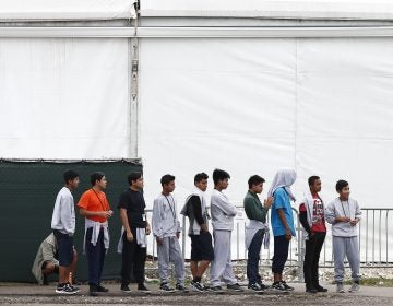 Migrant teens walk in a line at a shelter for unaccompanied children, on Monday, Dec. 10, 2018. (Brynn Anderson/AP Photo)