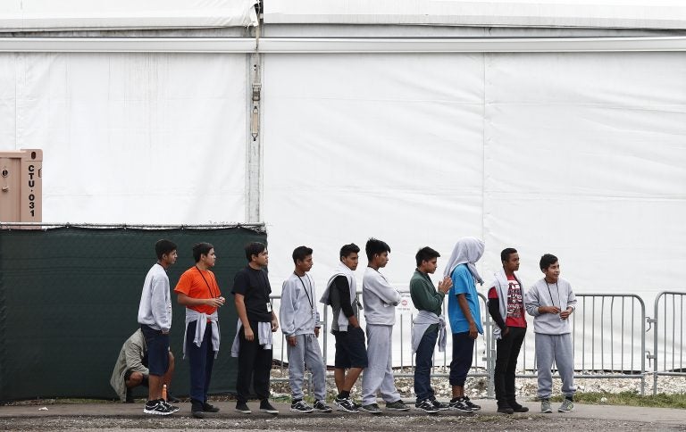 Migrant teens walk in a line at a shelter for unaccompanied children, on Monday, Dec. 10, 2018. (Brynn Anderson/AP Photo)