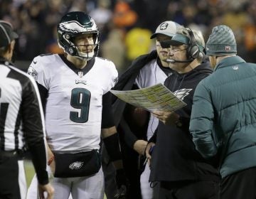 Philadelphia Eagles quarterback Nick Foles (9) talks to head coach Doug Pederson during the second half of an NFL wild-card playoff football game against the Chicago Bears Sunday, Jan. 6, 2019, in Chicago. (AP Photo/David Banks)