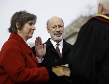 Pennsylvania Gov. Tom Wolf, accompanied by his wife Frances, takes the Oath of Office as he is sworn in for his second term, Tuesday, Jan. 15, 2019, at the state Capitol in Harrisburg, Pa. (Matt Rourke/AP)