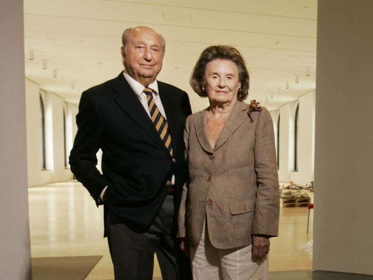 In this September 2007 photo, Raymond and Ruth Perelman pose for a photo in the exhibition gallery for the opening of the Philadelphia Museum of Art's Ruth and Raymond G. Perelman Building in Philadelphia. The businessman who built a fortune buying and selling factories and became one of the Philadelphia region's greatest philanthropists has died. Perelman was 101. His son Ronald Perelman says in a statement that his father died Monday night, Jan. 15, 2019. (Michael Bryant/The Philadelphia Inquirer via AP)