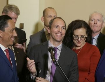  In this Jan. 24, 2019 file photo, Assemblyman Brian Maienschein, center, smiles at a news conference where he announced he was switching party registration from Republican to Democrat, in Sacramento, 
 California (Rich Pedroncelli/AP)