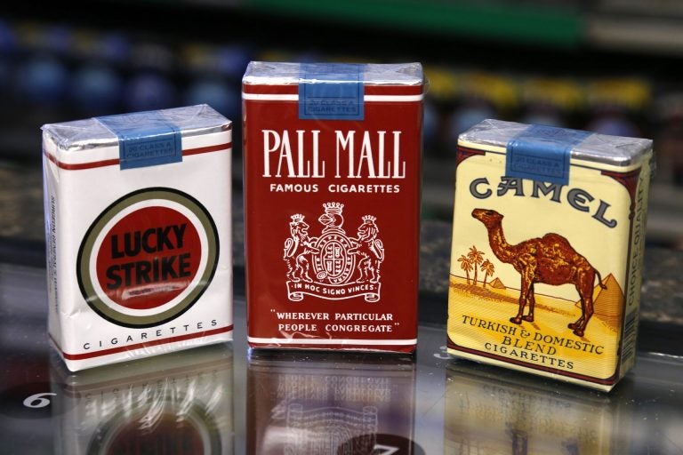 In this Friday, July 17, 2015 photo, unfiltered Lucky Strike, Pall Mall, and Camel cigarettes, Reynolds American brands, are on display at a Smoker Friendly shop in Pittsburgh. (Gene J. Puskar / The Associated Press)