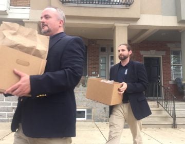 Unmarked boxes taken from John 'Johnny Doc' Dougherty's home during a raid in 2016. (Bobby Allyn/WHYY)