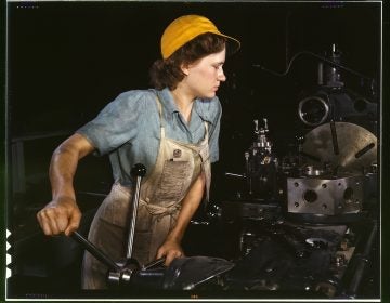A lathe operator machining parts for transport planes at the Consolidated Aircraft Corporation plant, Fort Worth, Texas 1942