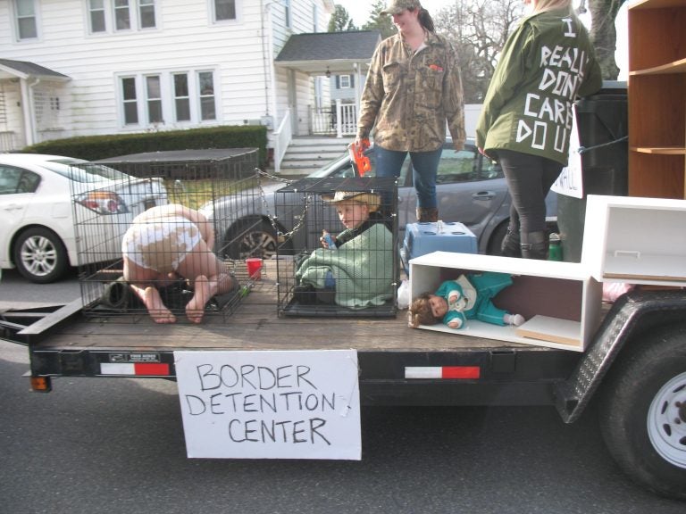 A controversial entry in this year's Hummers Parade in Middletown, Del. depicts migrant children in cages at the U.S.-Mexico border. (John Mussoni/WHYY)