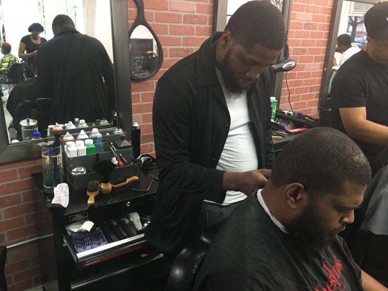 Philly-based barber B. Jawuan Jones wanted to give back to the community by giving free haircuts to homeless people. In 2017, he was gifted his own barber shop. Over the next five years, Jones hopes to open a homeless shelter. (Taylor Allen/WHYY News)