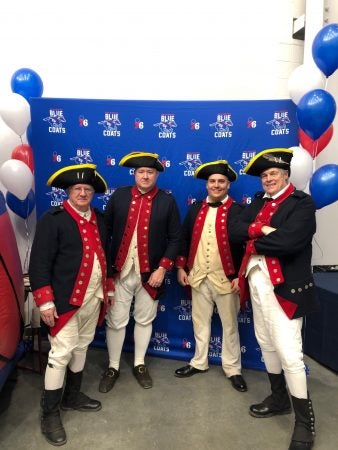 Blue Coats in Revolutionary War garb greeted fans at the arena Wednesday. (Cris Barrish/WHYY)