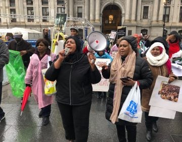 More than two-dozen members of the local Sudanese community showed their support for protestors in Khartoum on Saturday with a demonstration at Philadelphia City Hall to raise awareness and encourage people to write their U.S. representatives. (Darryl C. Murphy/WHYY)