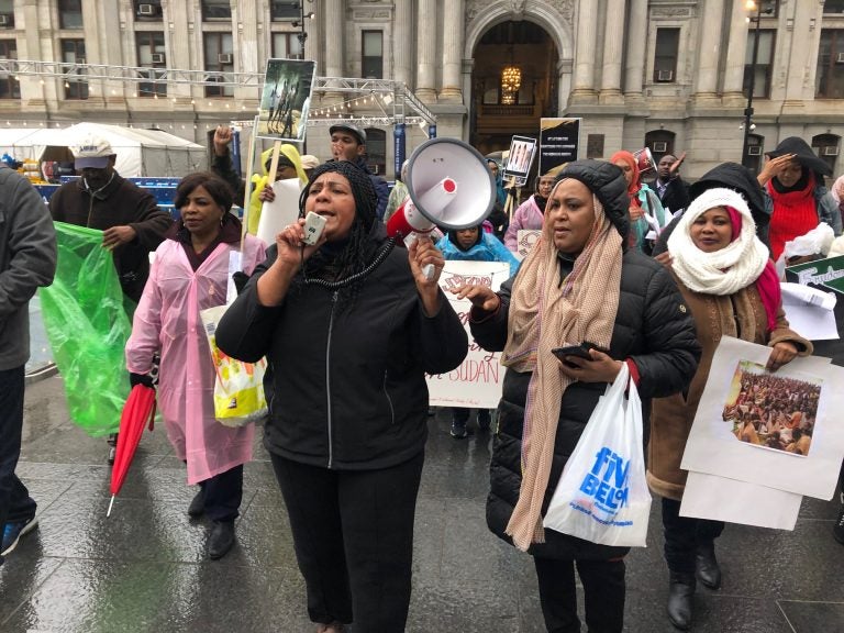 More than two-dozen members of the local Sudanese community showed their support for protestors in Khartoum on Saturday with a demonstration at Philadelphia City Hall to raise awareness and encourage people to write their U.S. representatives. (Darryl C. Murphy/WHYY)