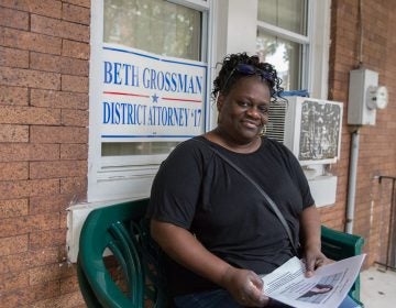 Daphne Goggins sits on her front porch in North Philadelphia. (Lindsay Lazarski/WHYY)