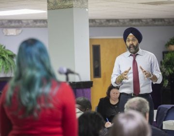 New Jersey Attorney General Gurbir Grewal responds to an audience member during a community listening session on police use of force in Bridgeton, N.J., Jan. 23, 2019. (Miguel Martinez for WHYY)