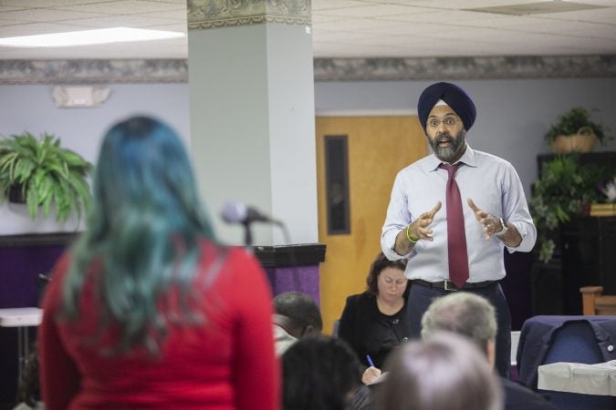 New Jersey Attorney General Gurbir Grewal responds to an audience member during a community listening session on police use of force in Bridgeton, N.J., Jan. 23, 2019. (Miguel Martinez for WHYY)