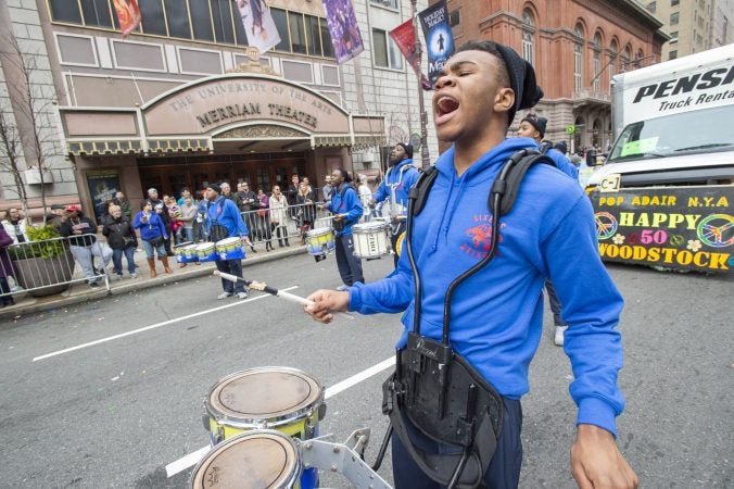 Members of the Sixers Stixers perform in front of the Merriam Theater. (Jonathan Wilson for WHYY)