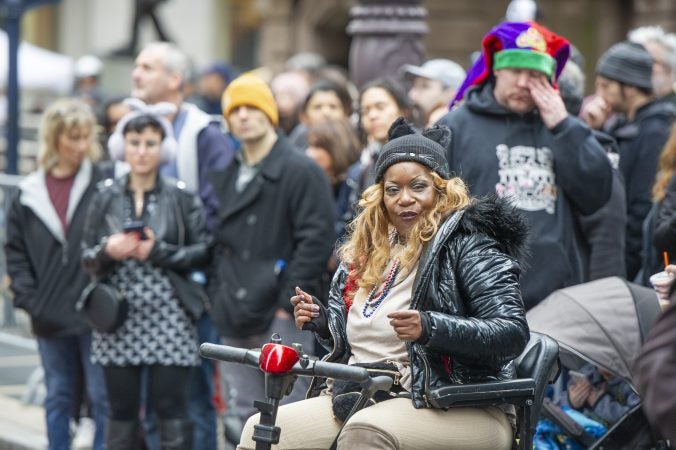 Carla Cowae of Newark DE gets her groove on as the Comic Division passes by on Broad St. (Jonathan Wilson for WHYY)