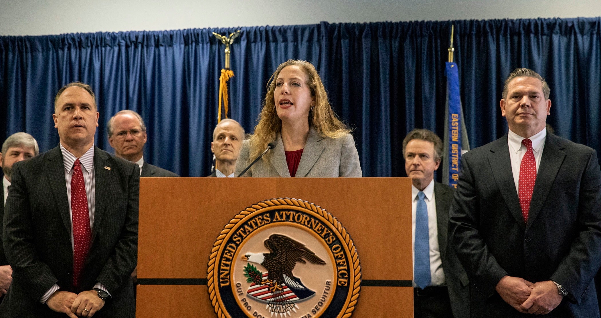 Jennifer Arbittier Williams, assistant United States Attorney with the Criminal Division of the U.S. Attorney's Office in Philadelphia, speaks at the podium next to Michael Harpster, right, FBI special agent of the Philadelphia Division, and Guy Ficco of the IRS, left, in the indictment of Local 98 leader John "Johnny Doc" Dougherty at the U.S. Attorney's office in Center City Philadelphia on Wednesday, Jan. 30, 2019.