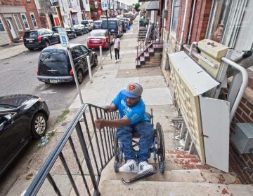 Rodney Whitmore of South Philadelphia was shot and paralyzed in 1995. When his wheelchair lift is broken, he tilts his wheelchair backward and lowers himself down his front steps so he can get to work.