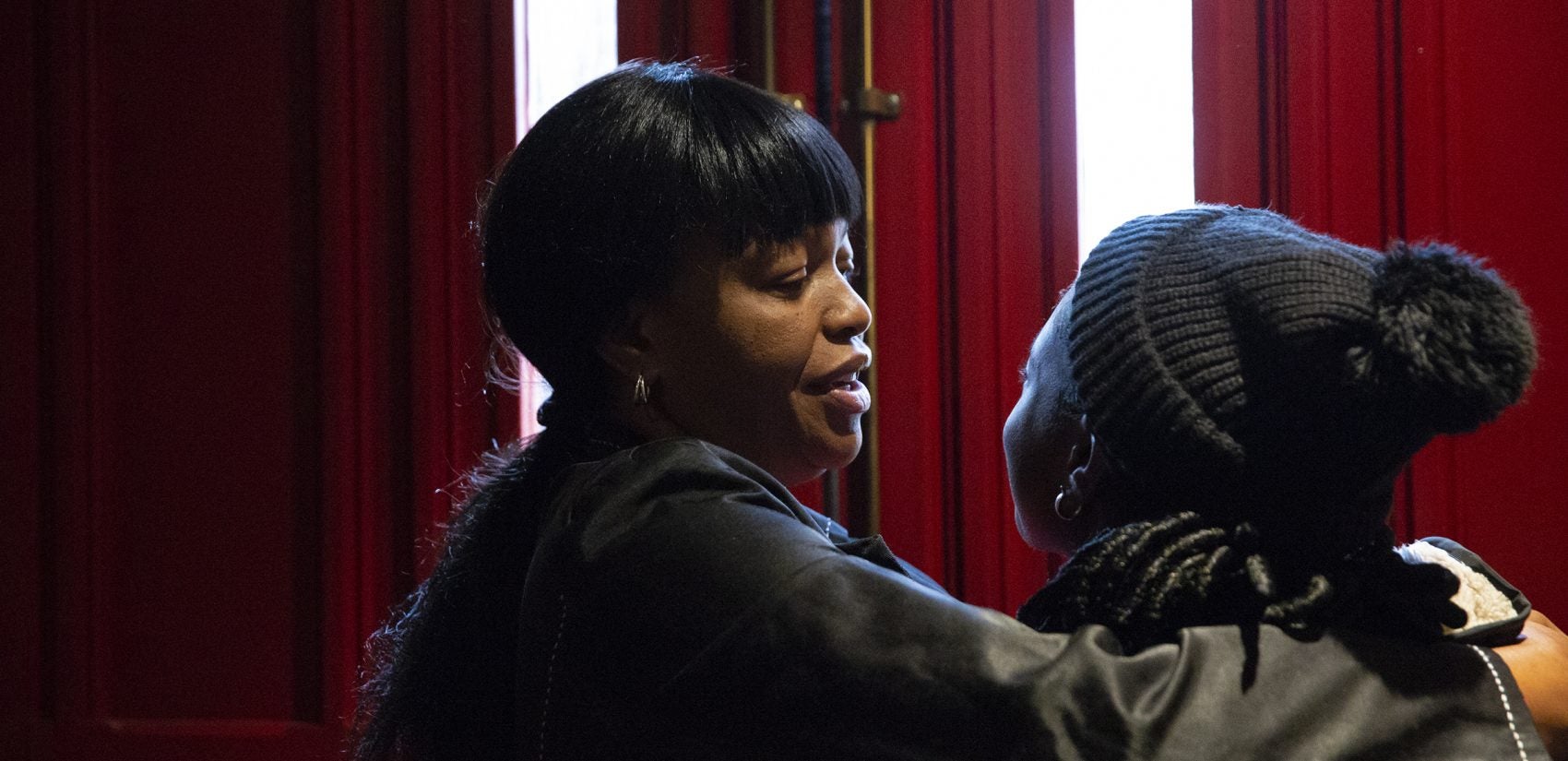 Oneita Thompson hugs her daughter Christine, who is 16, inside the First United Methodist Church of Germantown before she leaves for school on Monday, Nov. 12, 2018. (Heather Khalifa/The Philadelphia Inquirer)