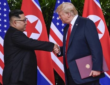 North Korean leader Kim Jong Un, and U.S. President Donald Trump shake hands at the conclusion of their first summit in Singapore last year. North Korea says preparations for a second summit are underway. (Susan Walsh/AP)