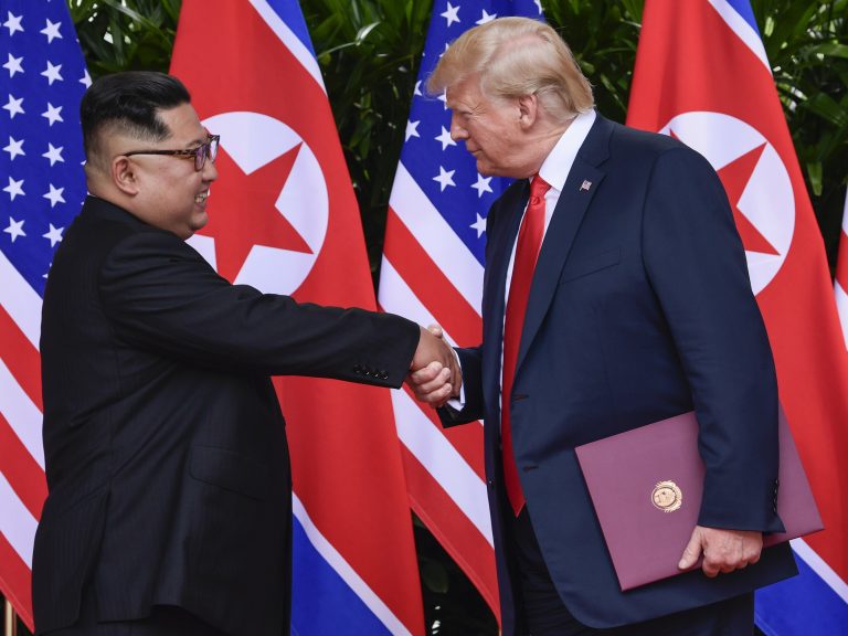 North Korean leader Kim Jong Un, and U.S. President Donald Trump shake hands at the conclusion of their first summit in Singapore last year. North Korea says preparations for a second summit are underway. (Susan Walsh/AP)