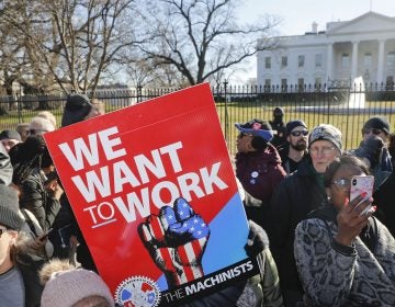 Union members and other federal employees protest in front of the White House on Thursday. Many are out of work as the partial government shutdown has dragged on longer than any in history. (Pablo Martinez Monsivais/AP)