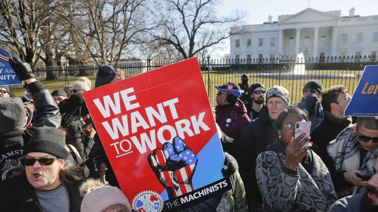 Union members and other federal employees protest in front of the White House on Thursday. Many are out of work as the partial government shutdown has dragged on longer than any in history. (Pablo Martinez Monsivais/AP)