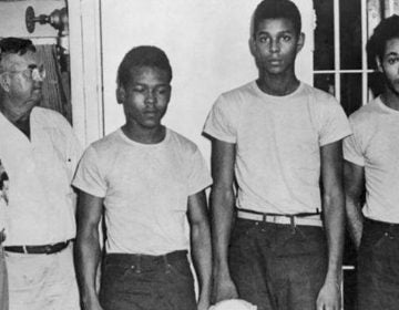 (From left) Lake County, Fla., Sheriff Willis McCall and an unidentified man stand next to Walter Irvin, Samuel Shepherd and Charles Greenlee. The three were accused of rape in 1949, along with a fourth man. They were all pardoned Friday. (State Library and Archives of Florida via AP)