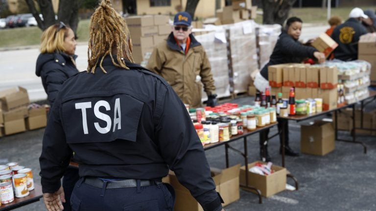 ap_19023694428631_wide-3f34dc57d0f8163dd40438e352e47b3b7bdfee2e-s800-c85 A TSA employee visits a Baltimore food pantry for government workers affected by the federal shutdown. (Patrick Semansky/AP)