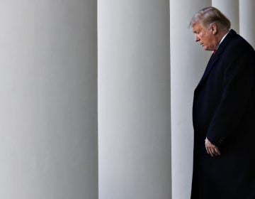 President Trump walks through the colonnade of the White House on arrival to announce a deal to temporarily reopen the government Friday. (Jacquelyn Martin/AP)