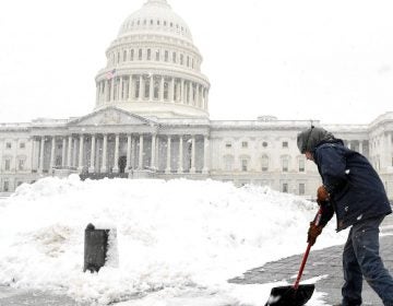 Aaron Rowe of the Architect of the Capitol’s office, which is not affected by the partial government shutdown, shovels snow left by a winter storm on the U.S. Capitol’s plaza.  (REUTERS/Mike Theiler)
