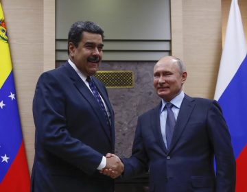 Russian President Vladimir Putin shakes hands with Venezuela's Nicolás Maduro during a meeting outside Moscow on Dec. 5. (Maxim Shemetov/AFP/Getty Images)