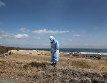 An employee of Tokyo Electric Power Co. works at Japan's Fukushima Dai-ichi nuclear power plant to decontaminate the area after the 2011 nuclear meltdown. A Vietnamese laborer in Japan on a training program says he was also put to work cleaning up the site, but with inadequate gear.
(Christopher Furlong/Getty Images)