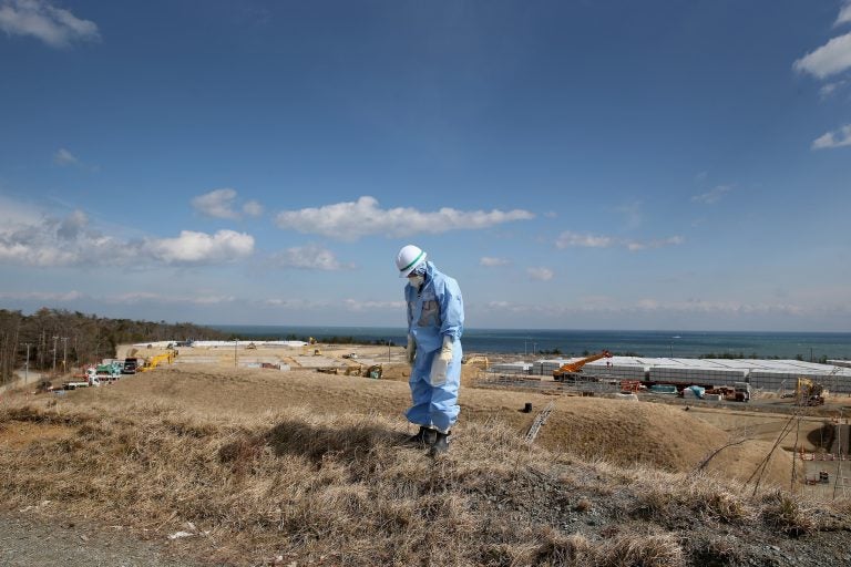 An employee of Tokyo Electric Power Co. works at Japan’s Fukushima Dai-ichi nuclear power plant to decontaminate the area after the 2011 nuclear meltdown. A Vietnamese laborer in Japan on a training program says he was also put to work cleaning up the site, but with inadequate gear. An employee of Tokyo Electric Power Co. works at Japan's Fukushima Dai-ichi nuclear power plant to decontaminate the area after the 2011 nuclear meltdown. A Vietnamese laborer in Japan on a training program says he was also put to work cleaning up the site, but with inadequate gear.
(Christopher Furlong/Getty Images)