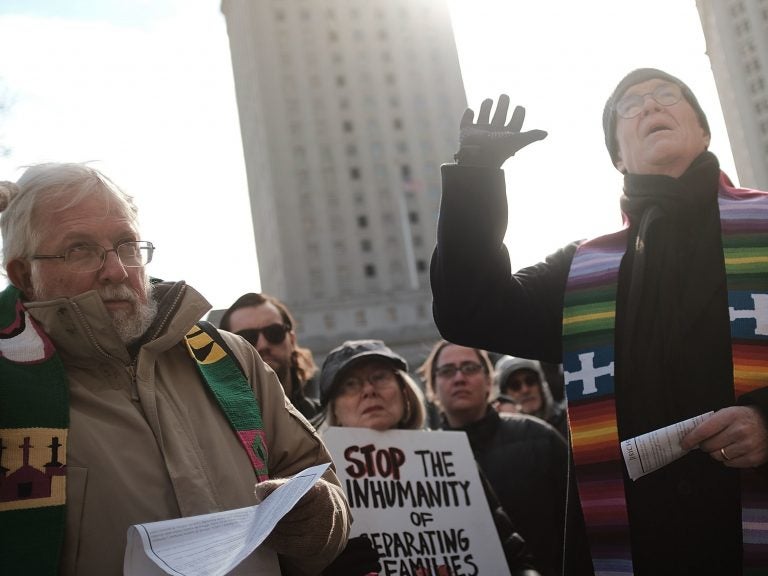 Dozens of clergy members, immigration activists and others participate in a protest against the imprisonment and potential deportation of an immigration activist. Religious liberals are becoming increasingly outspoken in their opposition to many Trump Administration policies.