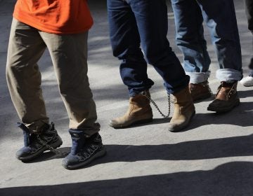 Unauthorized immigrants leave a court in shackles in McAllen, Texas. More than 40,000 immigration court hearings have been canceled since the government shutdown (John Moore/Getty Images)