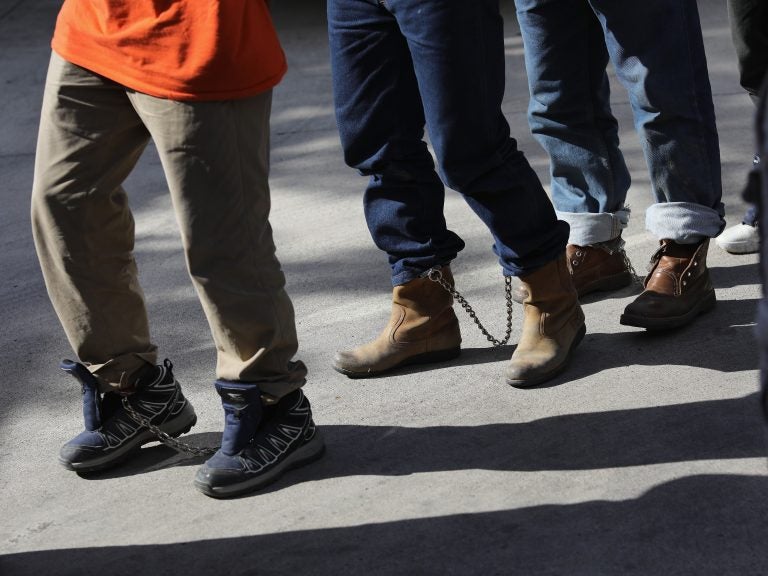 Unauthorized immigrants leave a court in shackles in McAllen, Texas. More than 40,000 immigration court hearings have been canceled since the government shutdown (John Moore/Getty Images)